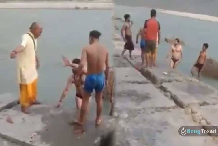 Sanyasi beat boys drinking in ganga river